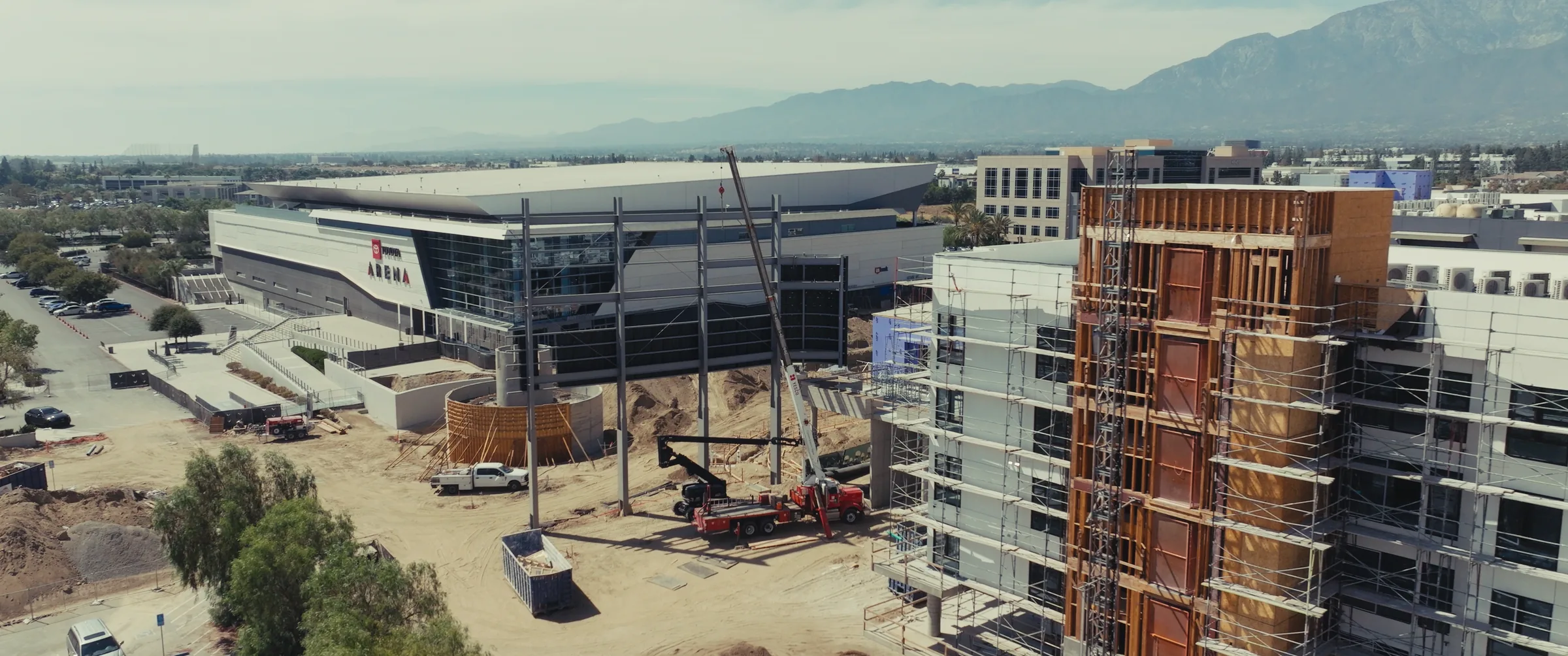 Cranes and framing on Phase One, with Toyota Arena behind