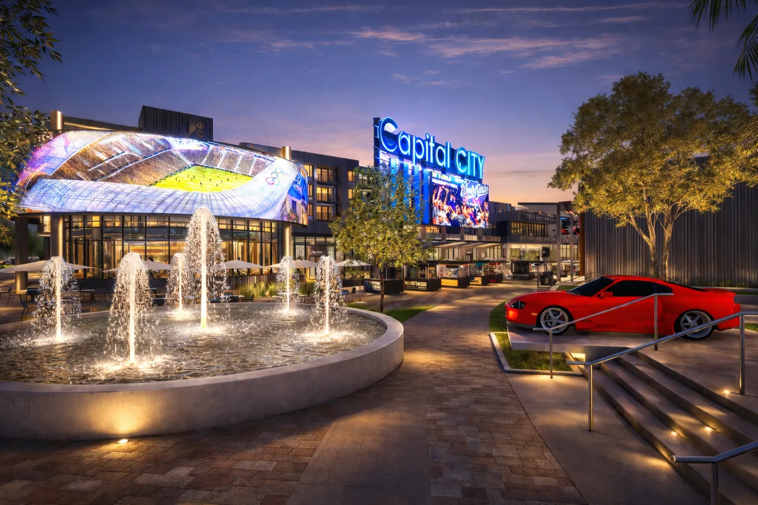 The Plaza fountain at night, with large LED screens lit behind it